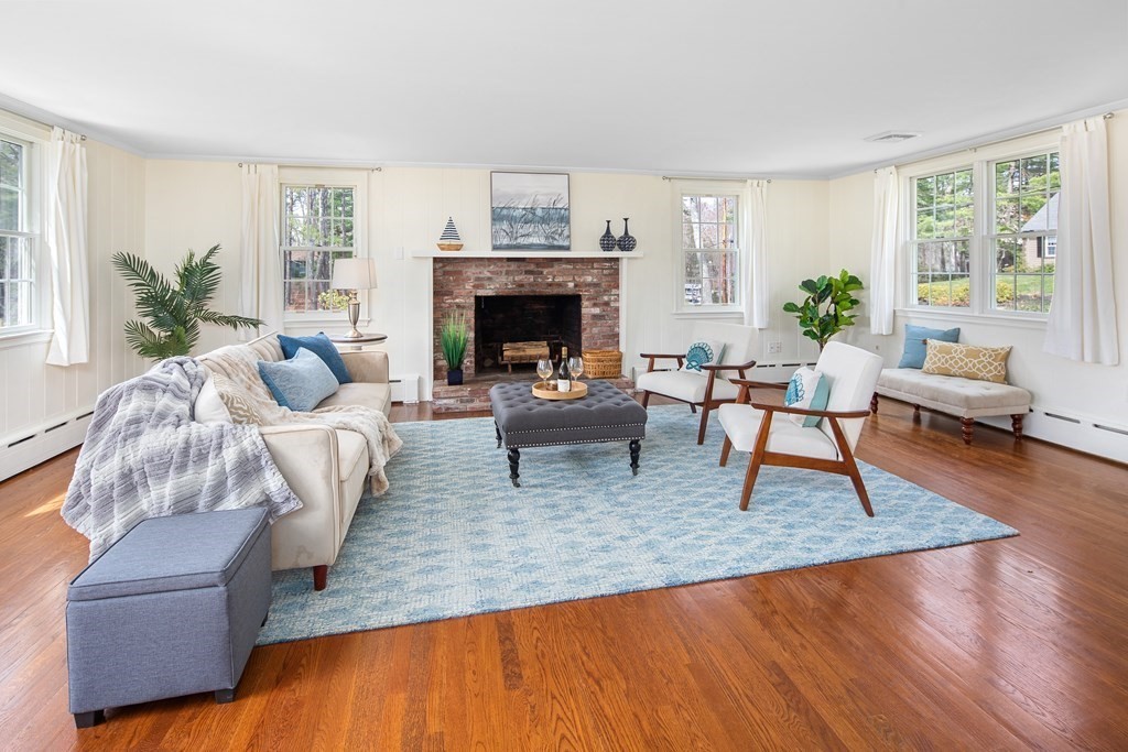 32 Howland Lane Hingham, MA 02043 - Photo 2 of 40 a living room with furniture and a fireplace