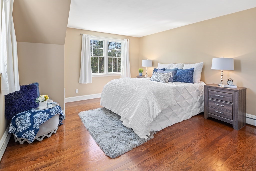 32 Howland Lane Hingham, MA 02043 - Photo 21 of 40 a bedroom with a bed dresser and a window