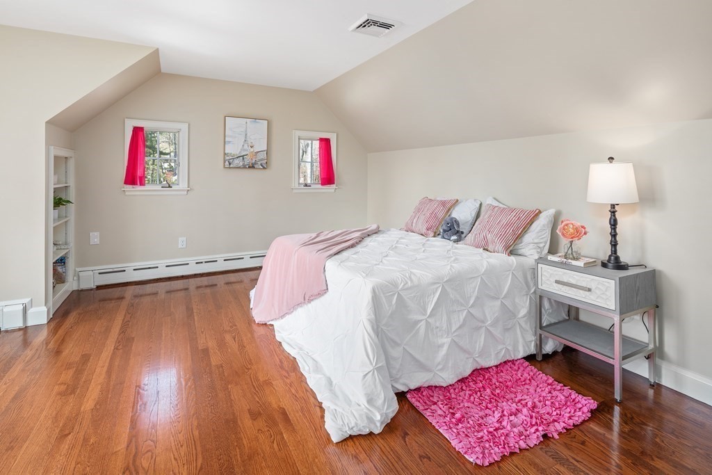 32 Howland Lane Hingham, MA 02043 - Photo 28 of 40 a bedroom with a bed and wooden floor