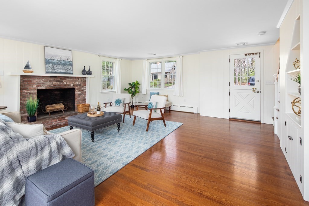 32 Howland Lane Hingham, MA 02043 - Photo 3 of 40 a living room with furniture and a fireplace