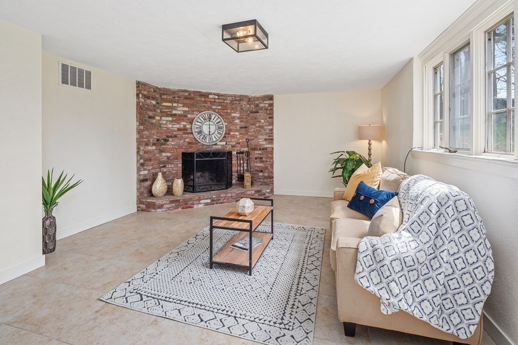 32 Howland Lane Hingham, MA 02043 - Photo 31 of 40 a living room with furniture and a fireplace