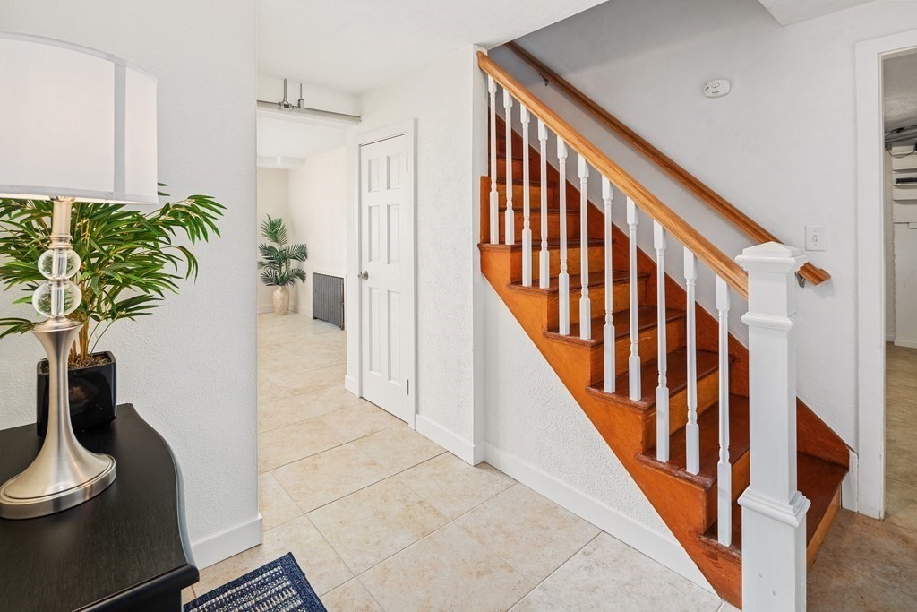 32 Howland Lane Hingham, MA 02043 - Photo 32 of 40 a view of entryway and hall with wooden floor