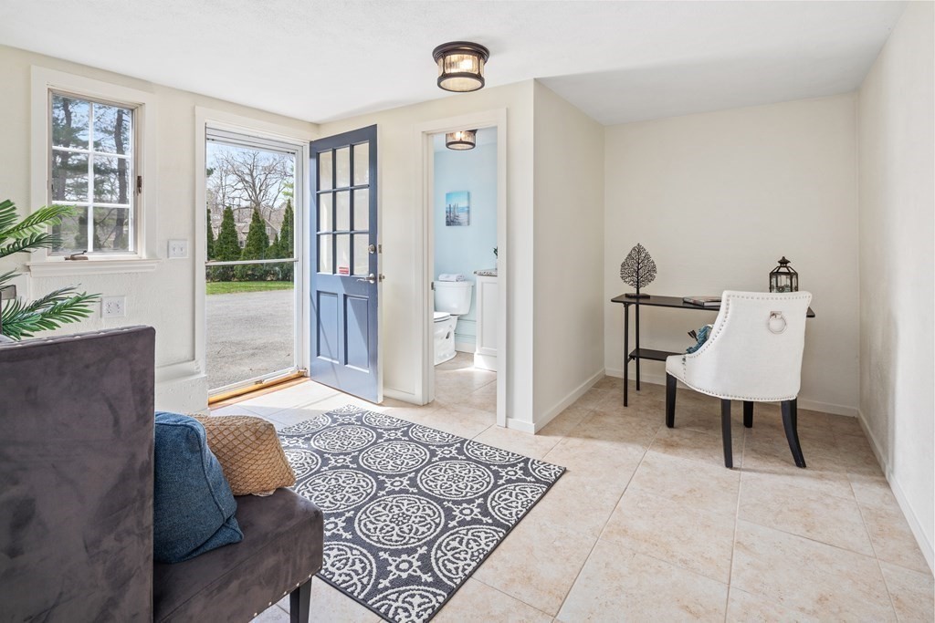 32 Howland Lane Hingham, MA 02043 - Photo 33 of 40 a living room with furniture and a window