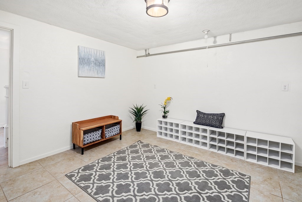 32 Howland Lane Hingham, MA 02043 - Photo 35 of 40 a room with a chair and a potted plant