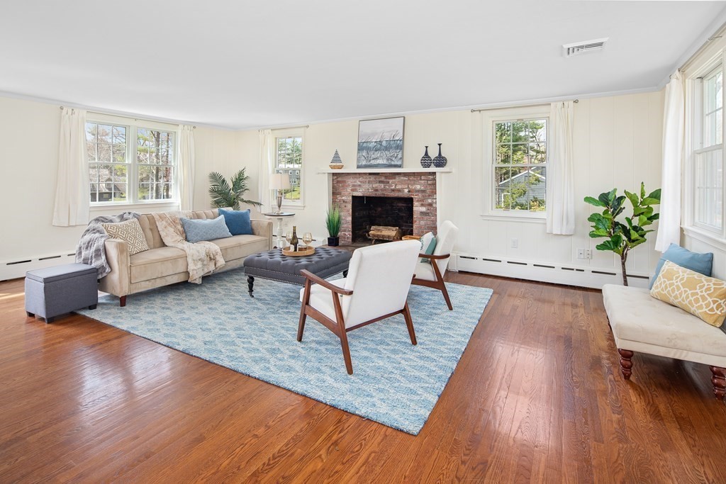 32 Howland Lane Hingham, MA 02043 - Photo 4 of 40 a living room with furniture and a fireplace