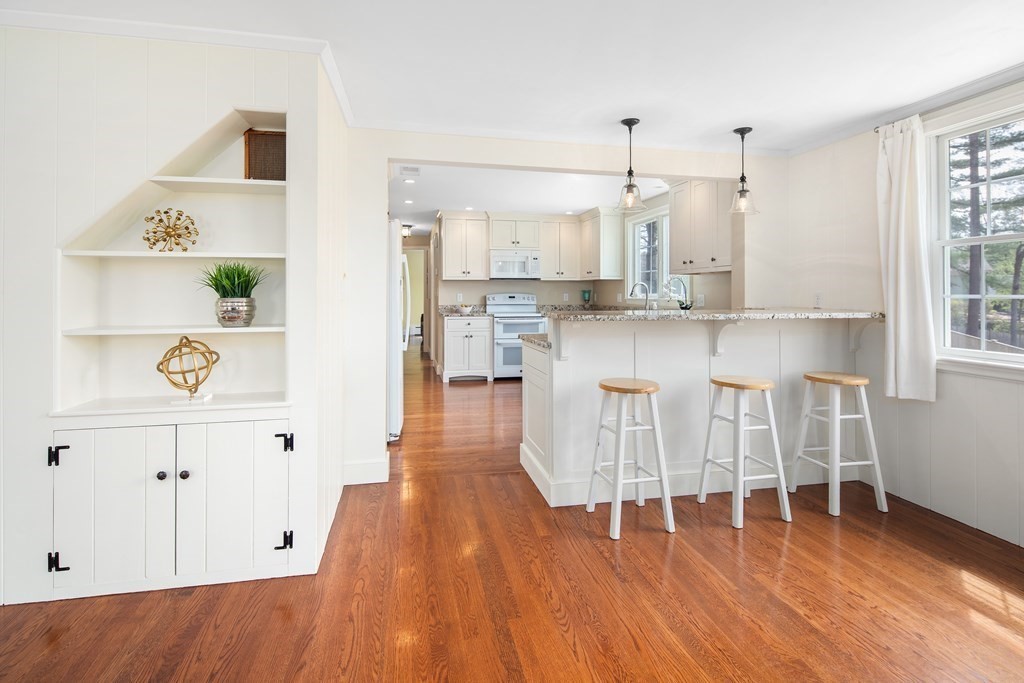 32 Howland Lane Hingham, MA 02043 - Photo 6 of 40 a kitchen with kitchen island wooden floors and center island