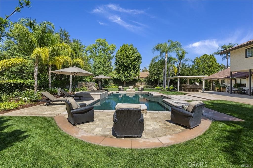 1623 Northhampton Drive Riverside, CA 92506 - Photo 14 of 59 a view of a house with backyard sitting area and swimming pool