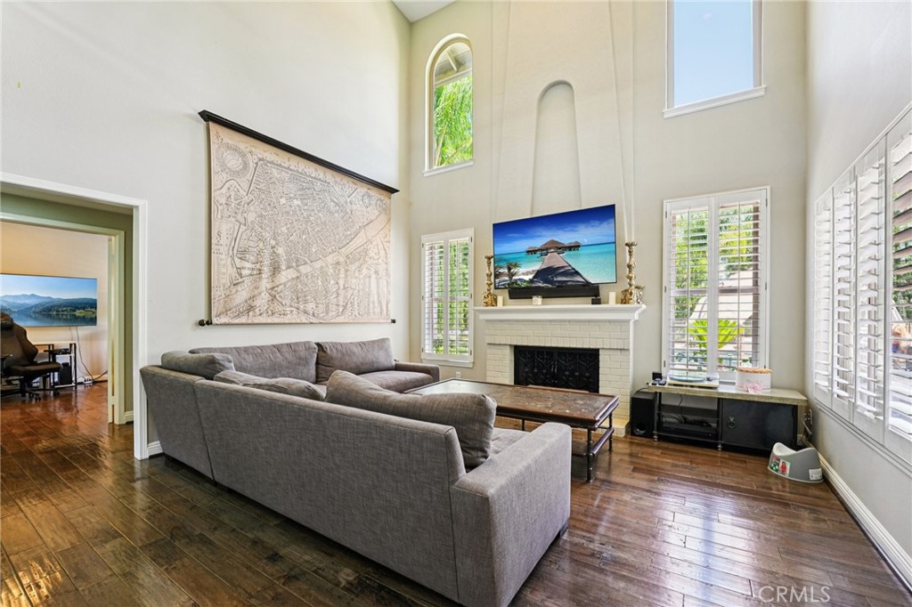 1623 Northhampton Drive Riverside, CA 92506 - Photo 15 of 59 a living room with furniture and a fireplace