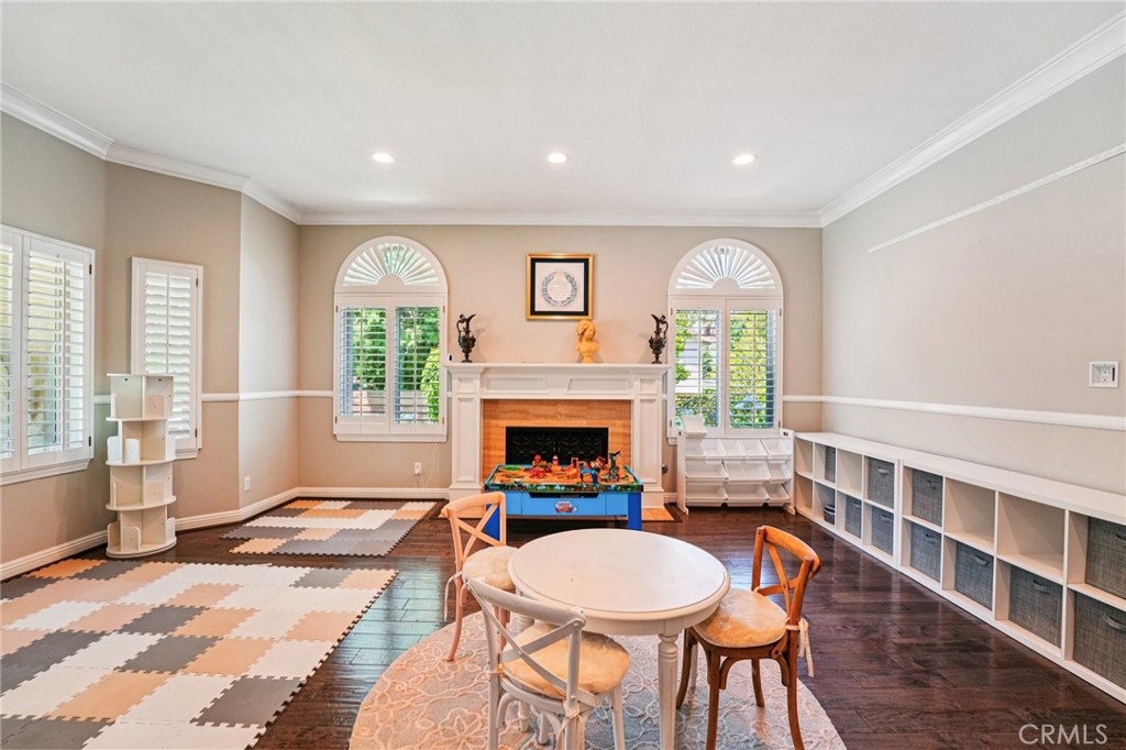1623 Northhampton Drive Riverside, CA 92506 - Photo 16 of 59 a living room with furniture a fireplace and a large window