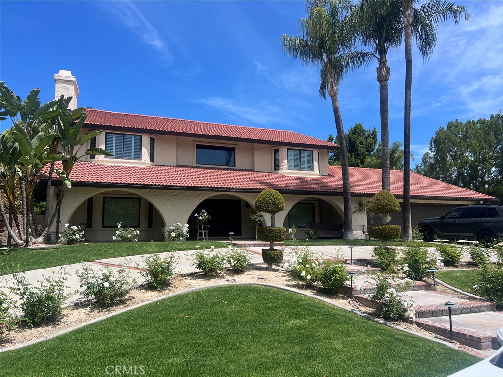 1623 Northhampton Drive Riverside, CA 92506 - Photo 2 of 59 a front view of a house with garden