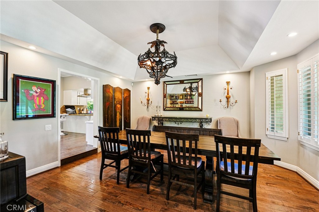 1623 Northhampton Drive Riverside, CA 92506 - Photo 21 of 59 a view of a dining room with furniture wooden floor and chandelier