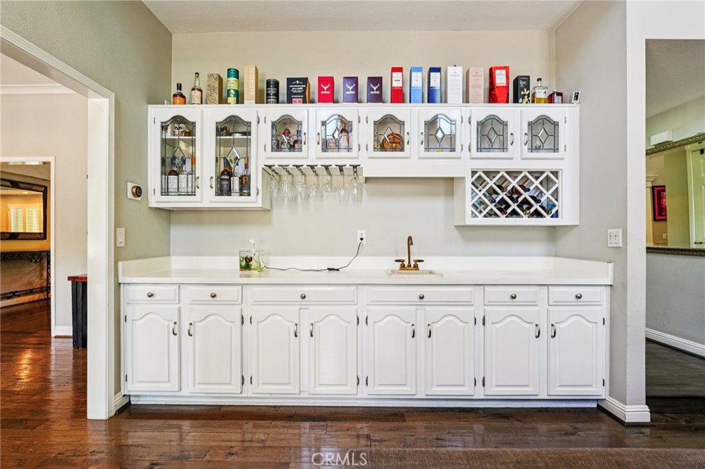 1623 Northhampton Drive Riverside, CA 92506 - Photo 27 of 59 a kitchen with white cabinets and white appliances