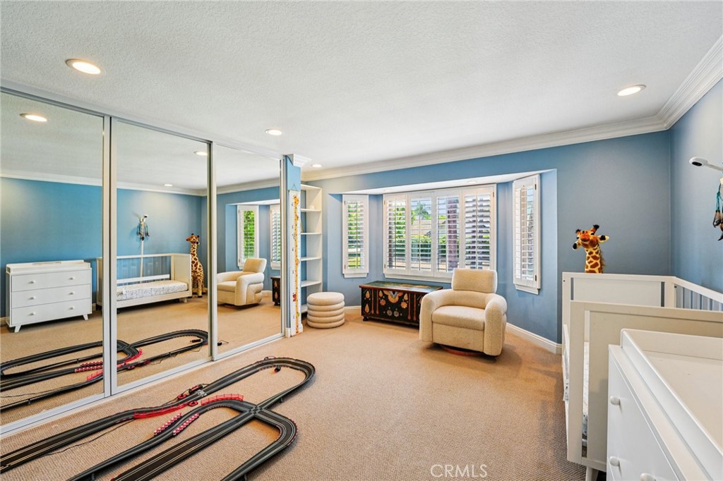 1623 Northhampton Drive Riverside, CA 92506 - Photo 34 of 59 a bedroom with furniture and large windows