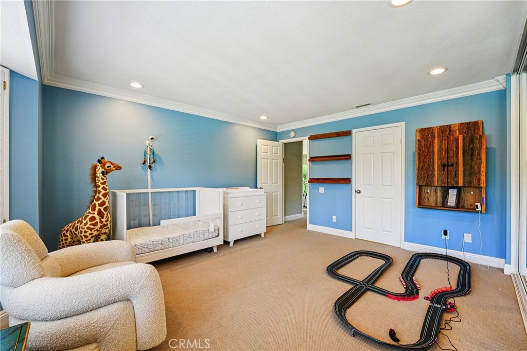 1623 Northhampton Drive Riverside, CA 92506 - Photo 35 of 59 a bedroom with furniture and a window