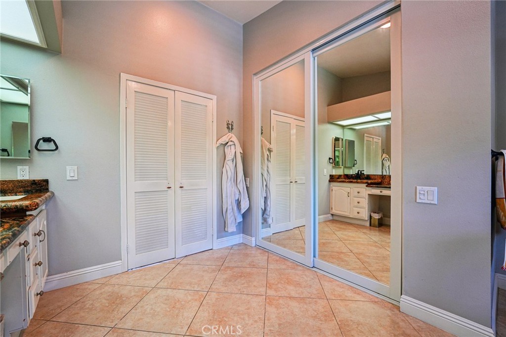 1623 Northhampton Drive Riverside, CA 92506 - Photo 45 of 59 a view of a hallway view with wooden floor and a living room