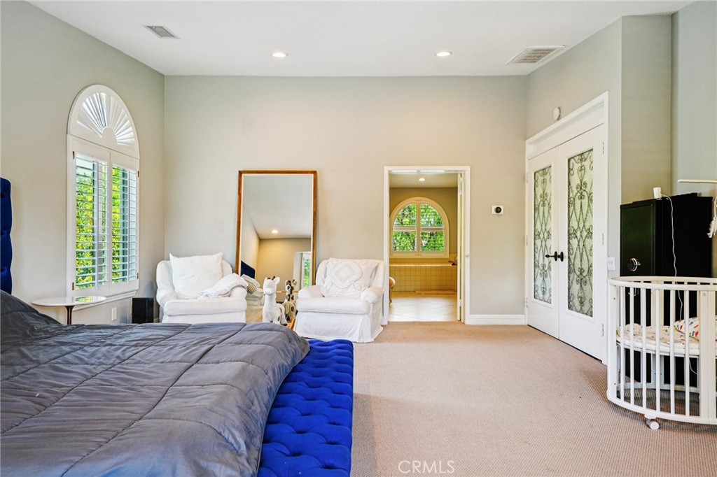 1623 Northhampton Drive Riverside, CA 92506 - Photo 48 of 59 a bedroom with furniture and a window