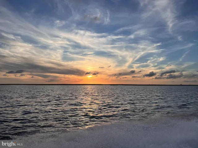 a bathroom with a sink mirror and vanity