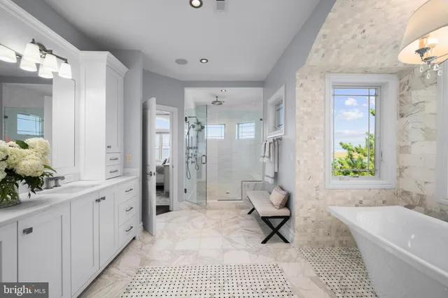 a bedroom with a large bed and a large window