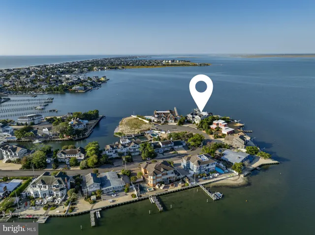 a view of kitchen and hall with wooden floor