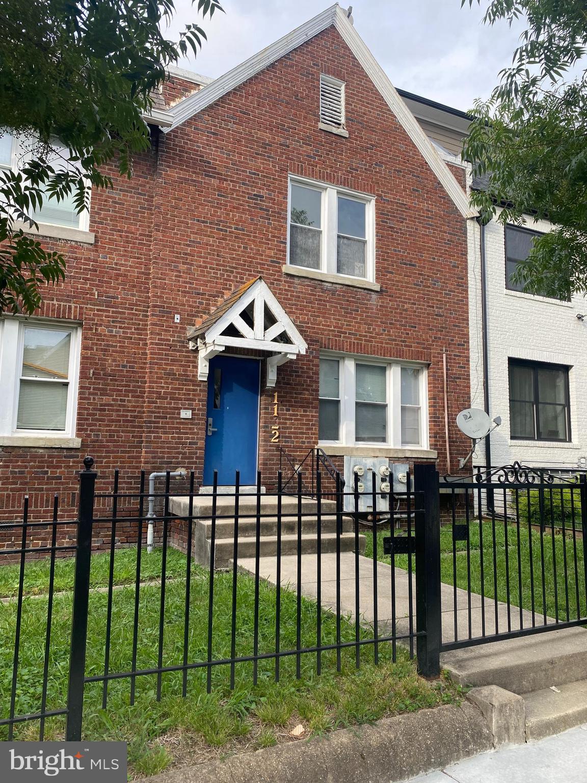 1122 Penn Street Northeast, Unit 1 Washington, DC 20002 - Photo 27 of 31 a front view of a house with a garden