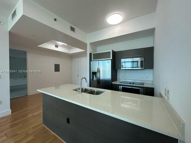 55 Southeast 6th Street, Unit 4100 Miami, FL 33131 - Photo 3 of 10 a bathroom with a sink and a mirror