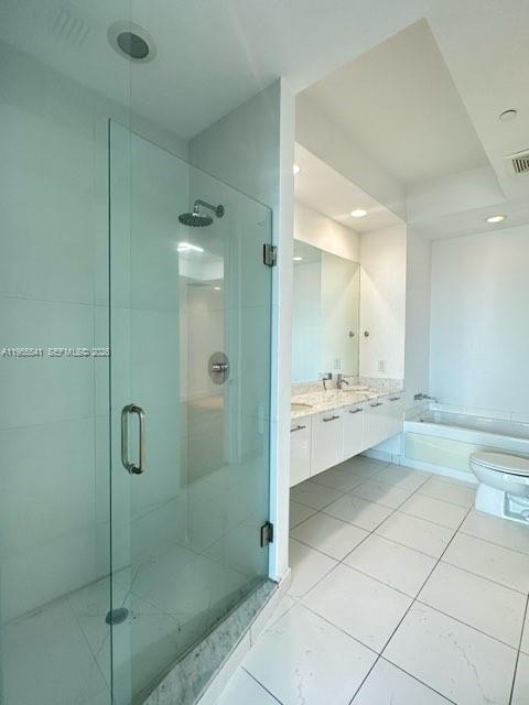 55 Southeast 6th Street, Unit 4100 Miami, FL 33131 - Photo 8 of 10 a bathroom with a mirror a shower and a sink