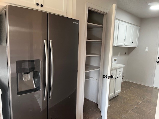 467 Buoy Road Webster, TX 77598 - Photo 20 of 21 pantry and utility room with refrigerator
