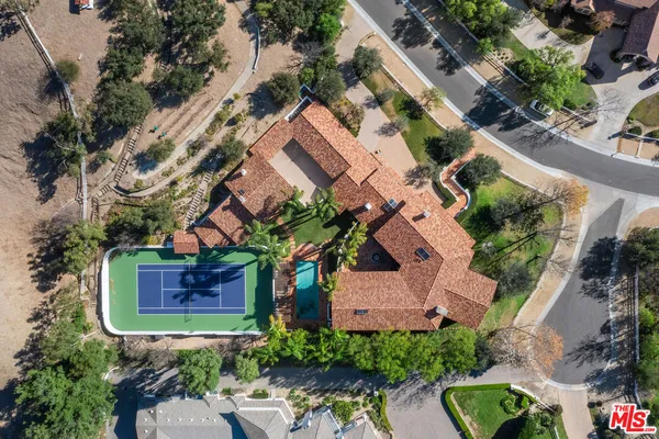 an aerial view of a house with outdoor space