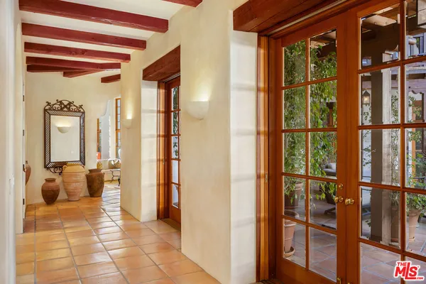 a view of an empty room with a balcony