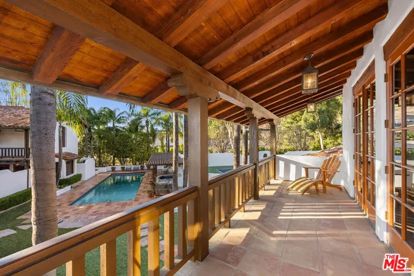 a view of a swimming pool with a patio