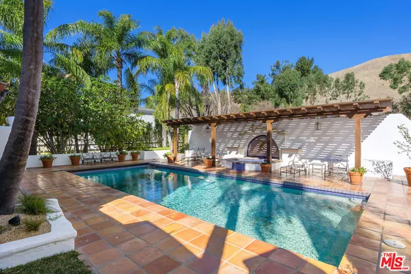 a view of a swimming pool with a patio
