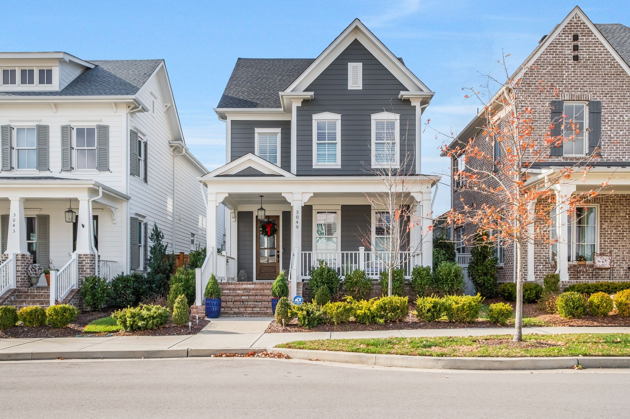 3049 Long Branch Circle Franklin, TN 37064 - Photo 1 of 30 front view of a brick house with a yard