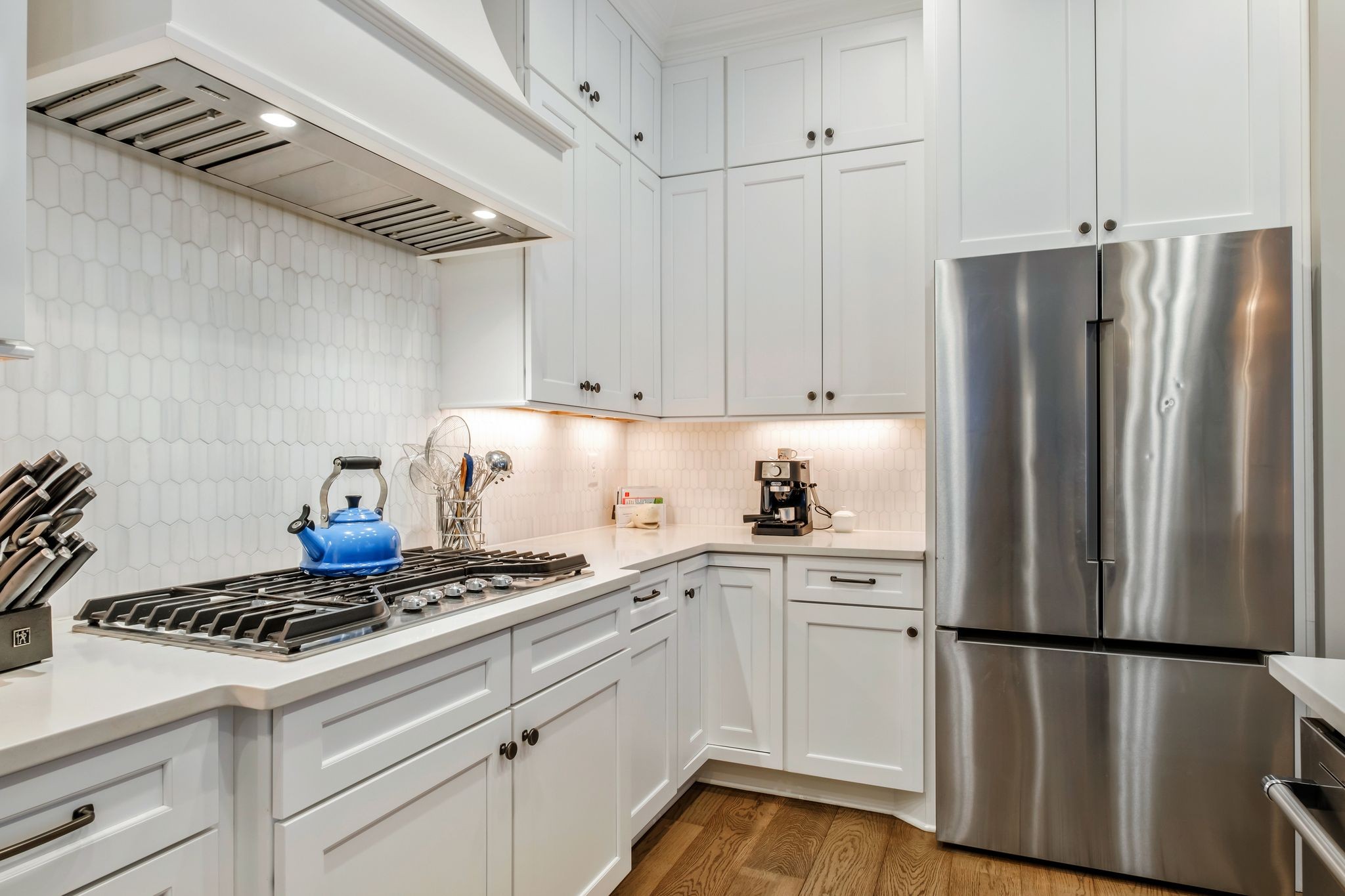 3049 Long Branch Circle Franklin, TN 37064 - Photo 14 of 30 a kitchen with stainless steel appliances a refrigerator a stove and white cabinets