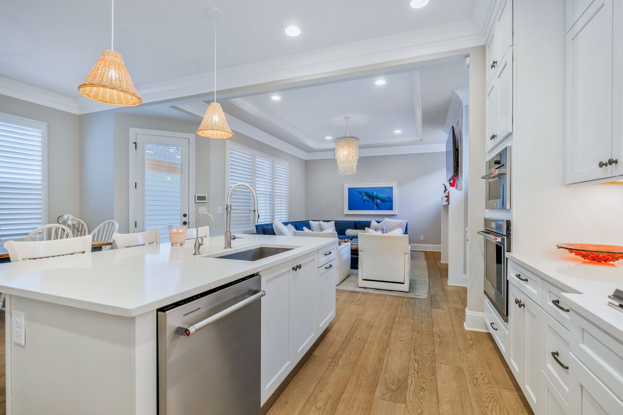 3049 Long Branch Circle Franklin, TN 37064 - Photo 15 of 30 a kitchen with white cabinets a sink dishwasher and a stove with wooden floor