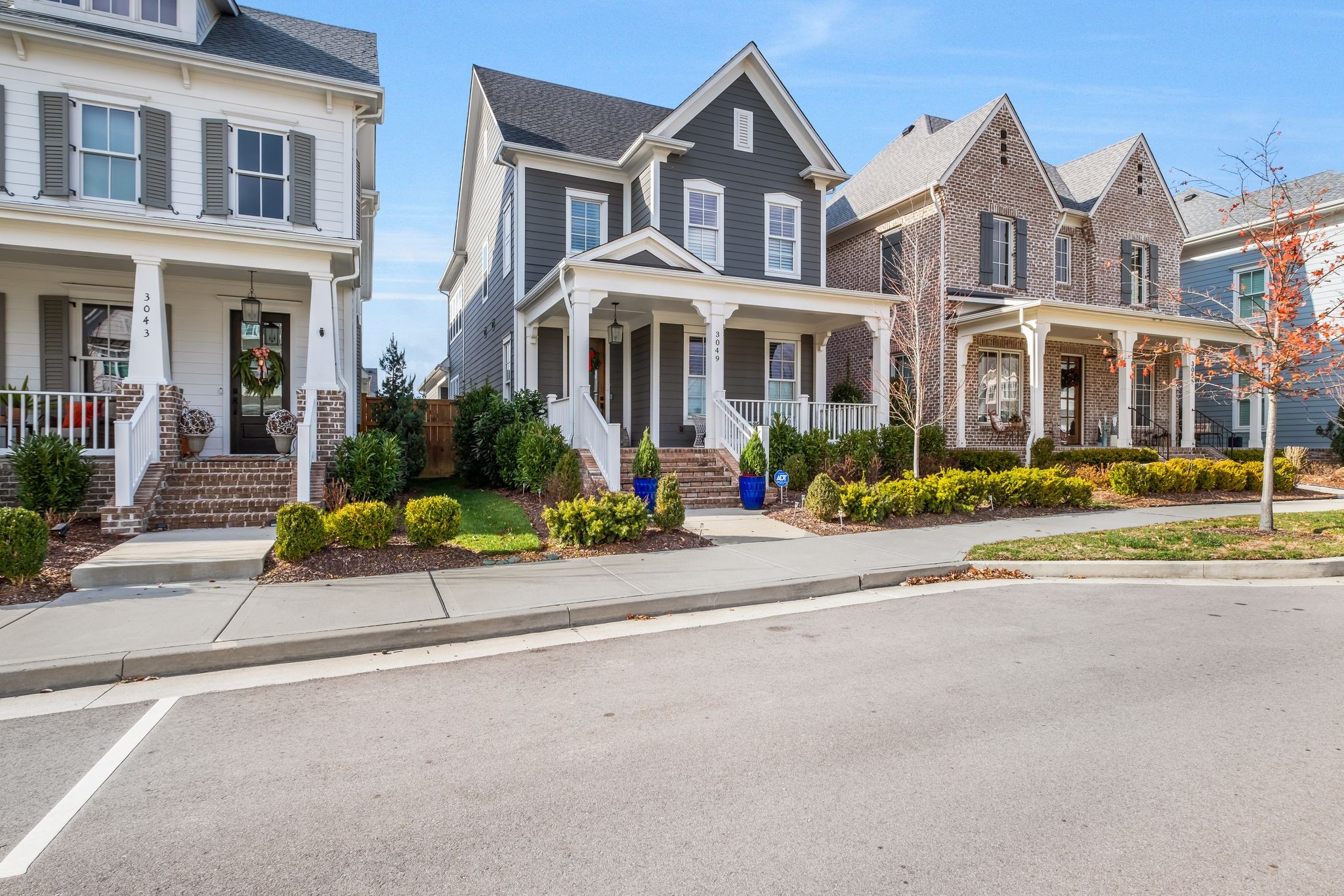 3049 Long Branch Circle Franklin, TN 37064 - Photo 2 of 30 front view of a brick house with a yard
