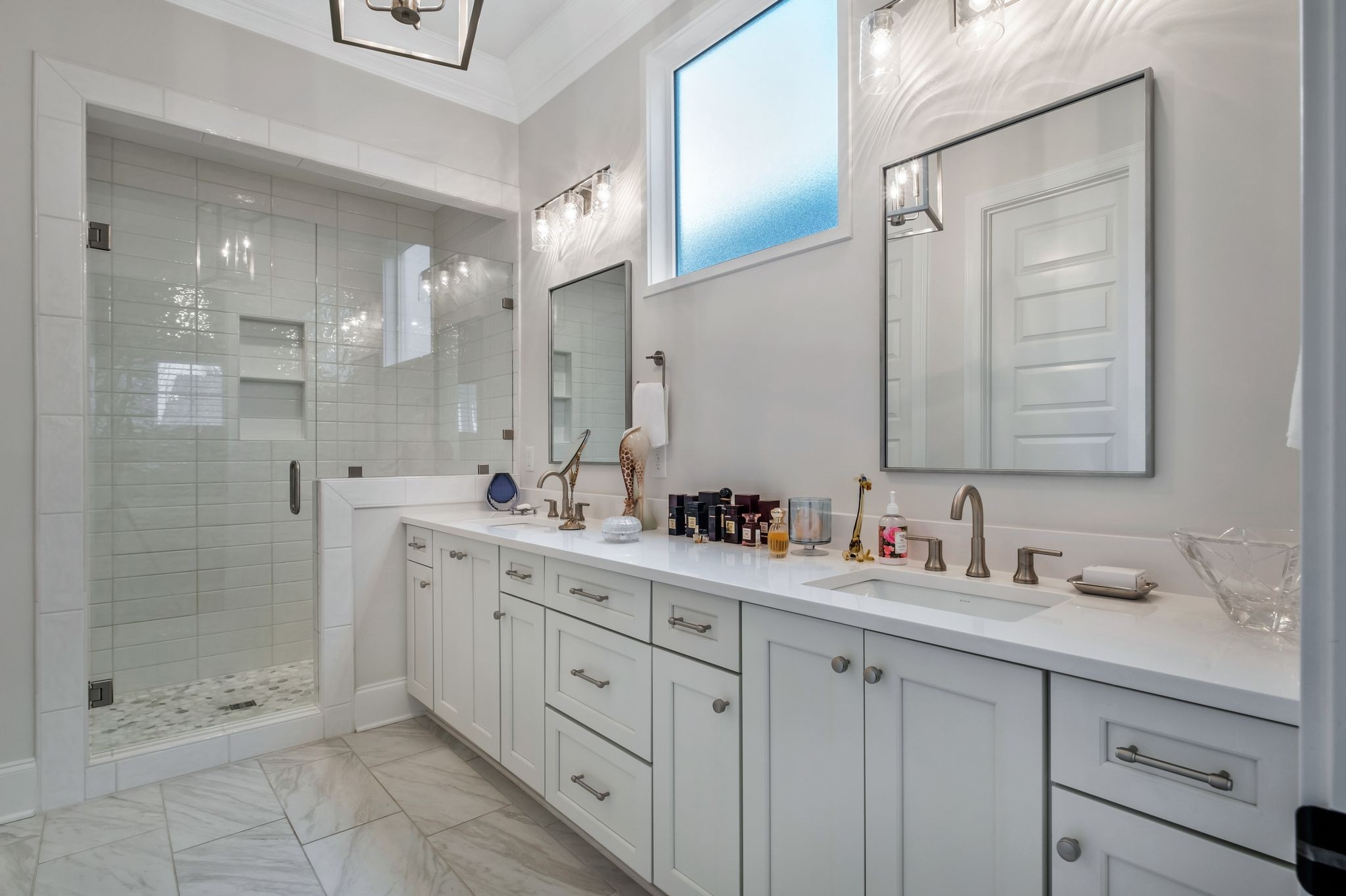 3049 Long Branch Circle Franklin, TN 37064 - Photo 7 of 30 a bathroom with a shower sink double and mirror
