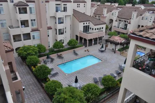an aerial view of a house with garden space and street view