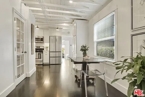 a view of a livingroom with furniture and a window