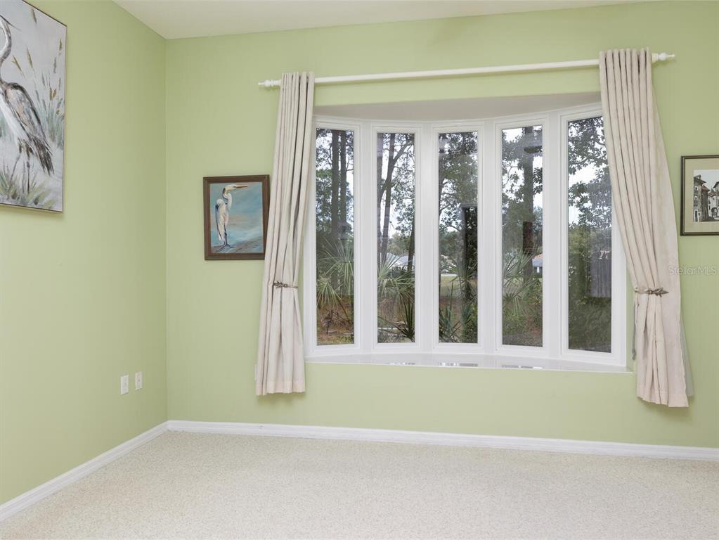 6635 Southwest 113th Place Ocala, FL 34476 - Photo 21 of 43 a view of a bathroom with a garden