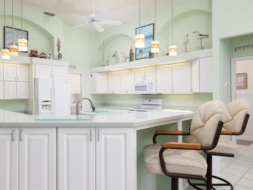6635 Southwest 113th Place Ocala, FL 34476 - Photo 9 of 43 a kitchen with a sink cabinets and window