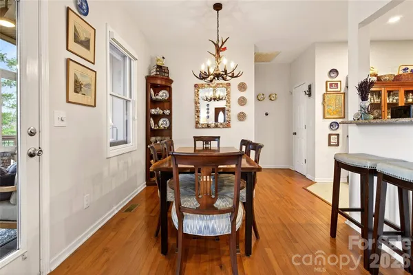 a view of a dining room with furniture and window