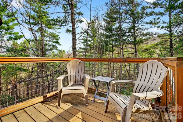 a view of a chairs and table on the deck
