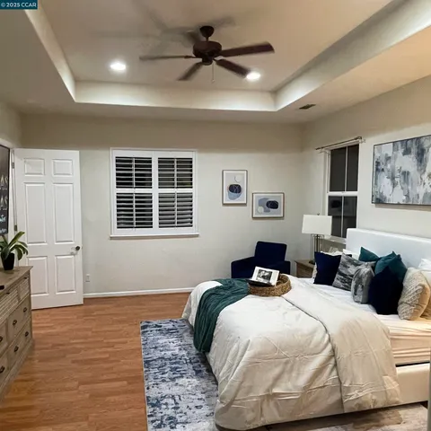 a bedroom with bed and window