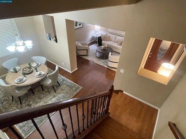a view of a living room and wooden floor