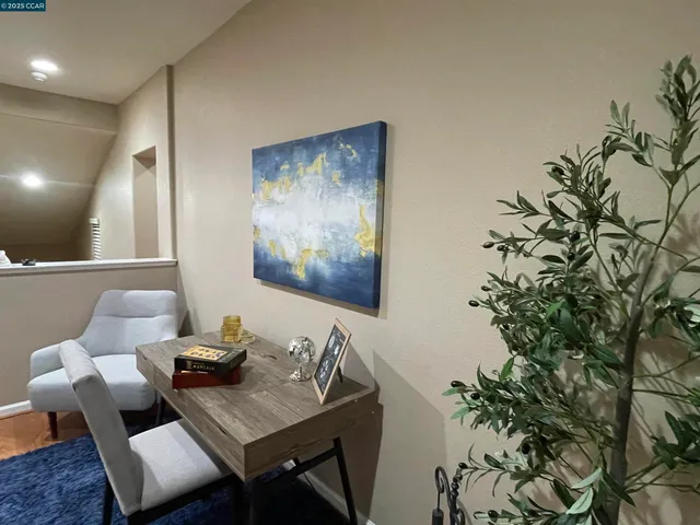 a view of a workspace with furniture