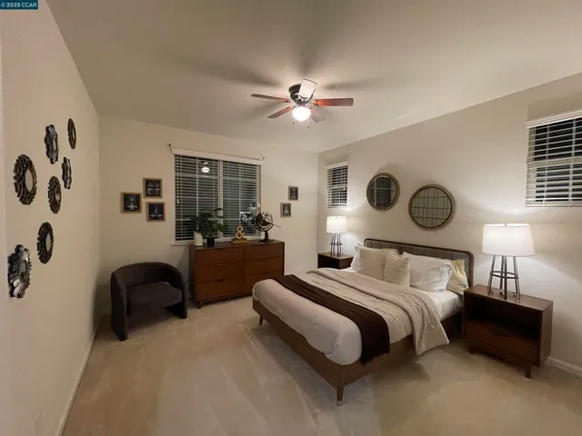 a bedroom with bed and a window