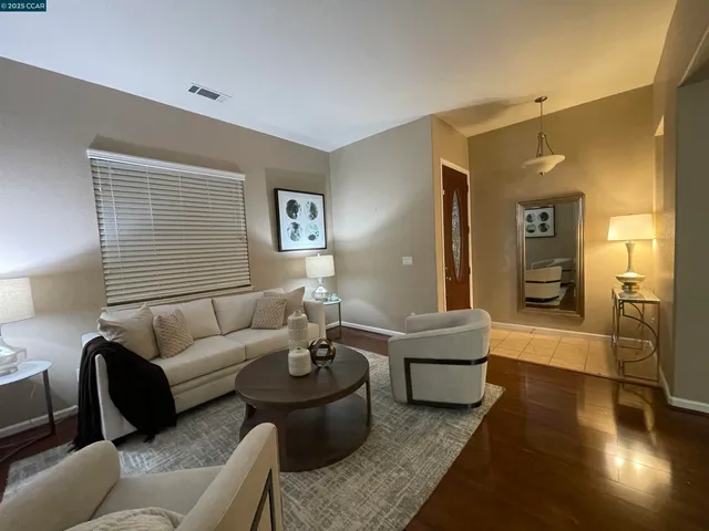 a living room with furniture and a couch