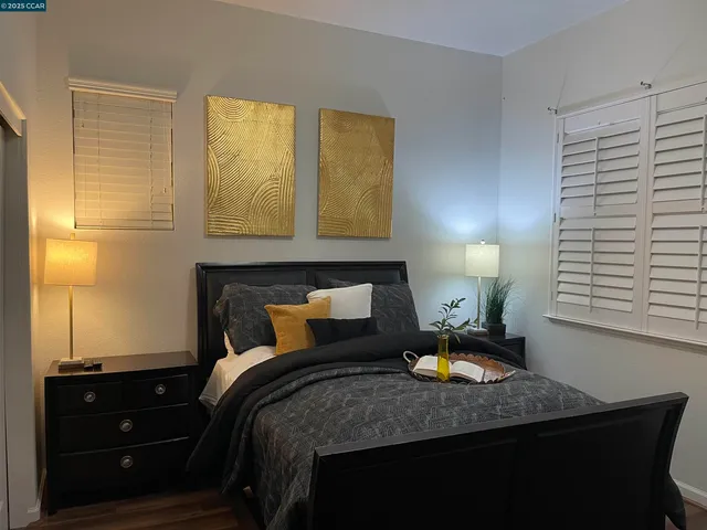 a bedroom with a bed and window