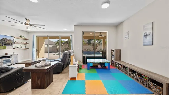 a living room with stainless steel appliances kitchen island granite countertop furniture and a kitchen view