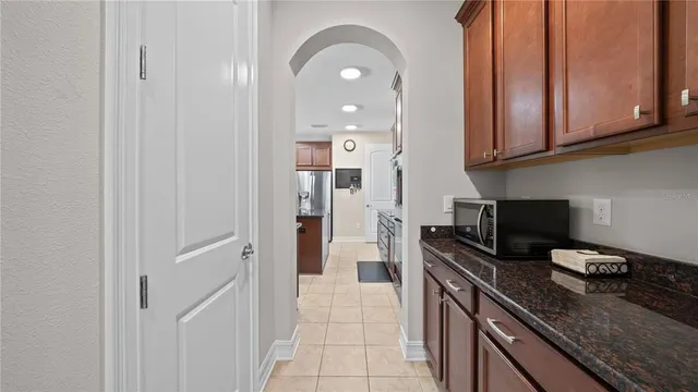 a spacious bathroom with a granite countertop sink and a mirror